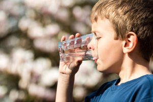 boy-drinking-purified-water